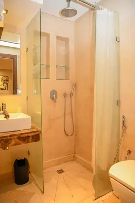 a bathroom with a shower and a sink at Chic & Modern in City Center - Pool, IPTV & Comfort in Marrakech