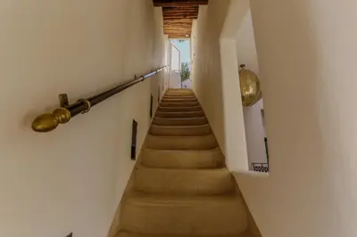 a staircase in a building with a long stair case at Riad KO Nova in Marrakech