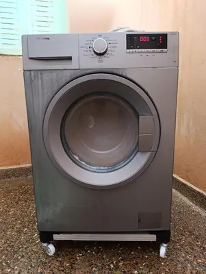 a washing machine is sitting on a floor at Marrakech welcome in Marrakech