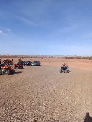 a group of atvs and cars parked in the desert at Marrakech welcome in Marrakech