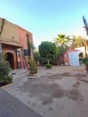 an empty parking lot in front of a building at Relaxing Family Home outside Marrakech in Marrakech