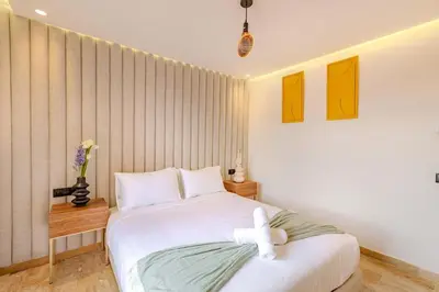 a bedroom with a white bed with a white bow on it at Elegant 2BR apartment in Gueliz in Marrakech