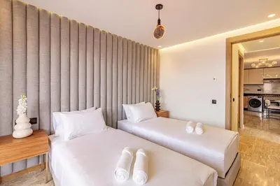 two beds in a hotel room with white pillows at Elegant 2BR apartment in Gueliz in Marrakech