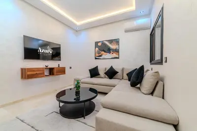 a living room with two couches and a tv at New! Apartment Gueliz 2 min M Avenue with Pool and 24h Security & Parking in Marrakech