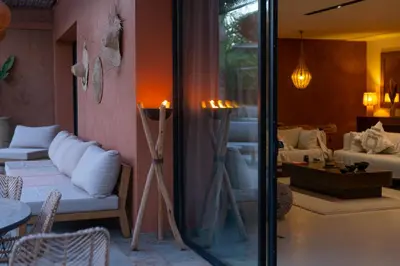 a living room with a couch and a table at Villa luxe Dar Paumar, Marrakech in Marrakech