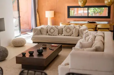 a living room with a couch and a coffee table at Villa luxe Dar Paumar, Marrakech in Marrakech