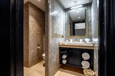 a bathroom with a sink and a mirror at Riad N5 in Marrakech