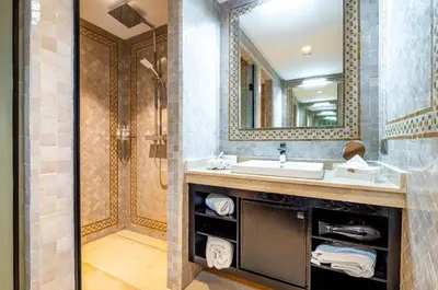 a bathroom with a sink and a mirror at Riad N5 in Marrakech