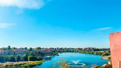 a view of a river with houses and buildings at Appartement PRESTIGIA MARRAKECH VILLAGE in Marrakech