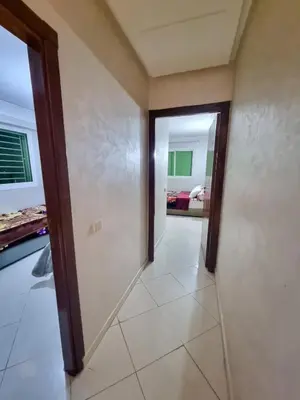 a hallway with a door leading to a bedroom at Relaxing Stay Close to Everyting in Marrakech