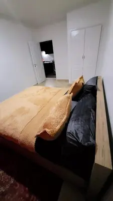 a bedroom with a large bed in a room at Le Central Hivernage 8-37-44 face gare CTM et a 10mn de l'aéroport in Marrakech