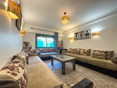 a living room with a couch and a table at Majorelle Apartment 1- Bedroom 1-Terrace Centre in Marrakech