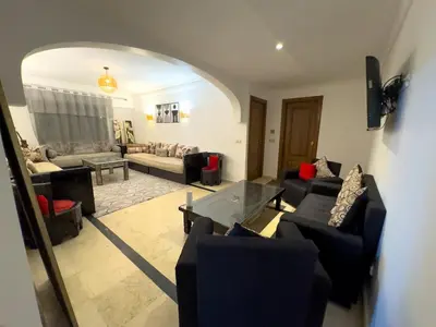 a living room with couches and a table at Majorelle Apartment 1- Bedroom 1-Terrace Centre in Marrakech