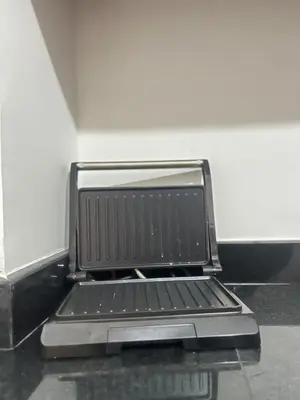 an open laptop computer sitting on top of a table at Cozy Apartment With Pool 5 min from Guéliz in Marrakech