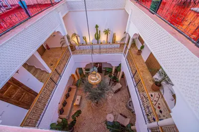 an overhead view of a building with a living room at Riad Amskal in Marrakech