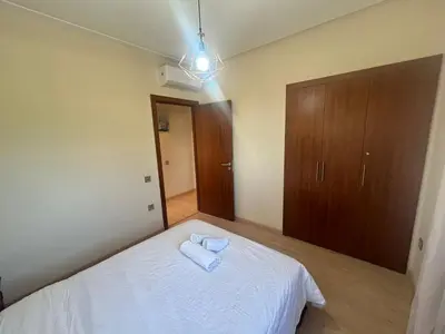 a bedroom with a bed with two towels on it at Prestigia residences in Marrakech