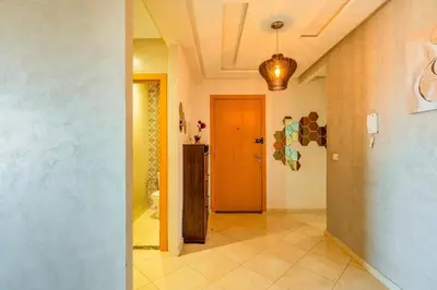 a hallway with a door leading to a room at Logement entier Appartement Cosy - Marrakech in Marrakech