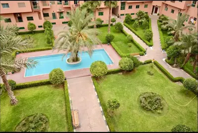 an aerial view of a courtyard with a swimming pool at Charming Two-Bedroom Apartment in Gueliz,Marrakesh in Marrakech