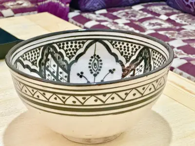 a black and white bowl sitting on a table at Dar Safary in Marrakech