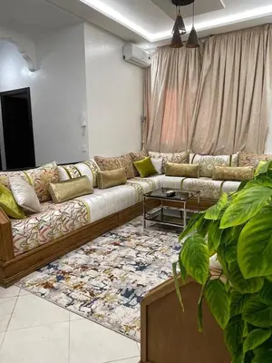 a living room with a couch and a rug at Apartment in Marrakesh in Marrakech