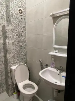 a bathroom with a toilet and a sink at Apartment in Marrakesh in Marrakech