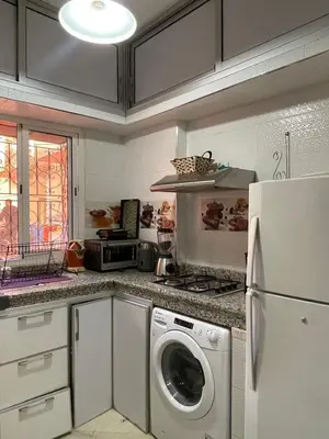 a kitchen with a washing machine and a refrigerator at Apartment in Marrakesh in Marrakech