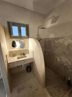 a bathroom with a sink and a shower at Riad Choubi 3 Bedroom Medina in Marrakech
