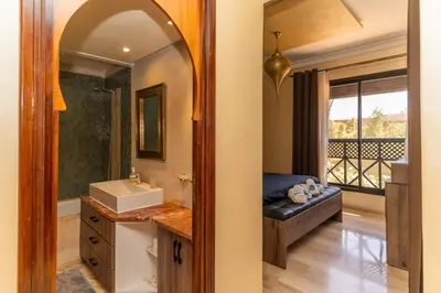 a bathroom with a sink and a mirror at Marrakech Private Pool Villa in Marrakech