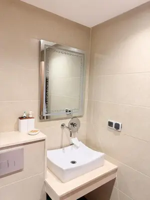 a bathroom with a sink and a mirror at Appartement au cœur de Marrakech in Marrakech