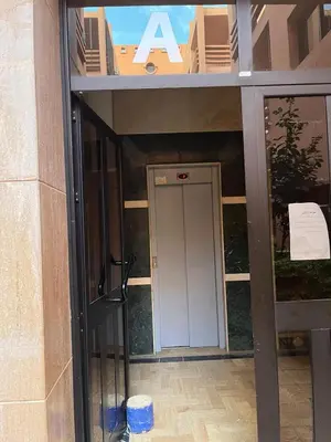 an entrance to a building with a white door at Family residence with a pool in Marrakech