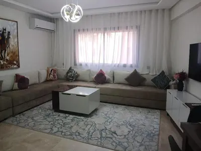 a living room with a couch and a window at marrakech semlalia gueliz in Marrakech