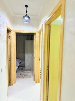 an open doorway to a room with a bed at Appartement Calme Parfait & Centre-ville in Marrakech