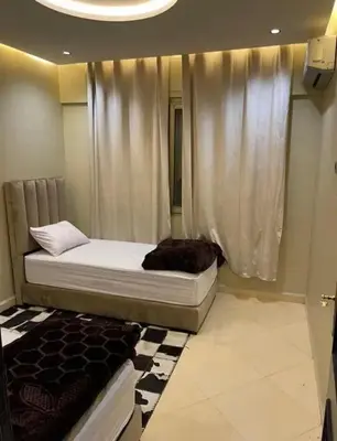 a bedroom with a bed and a curtain at Apartment au cœur de Marrakesh in Marrakech