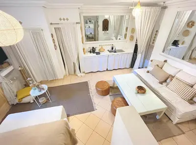 a living room with a couch and a table at Comfort bubble ideally located in Guéliz in Marrakech