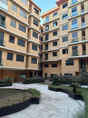 a large building with a courtyard in front of it at Nuit d'Amazay in Marrakech