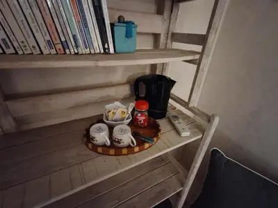 a tray with a coffee maker on a shelf at Riad Dom in Marrakech