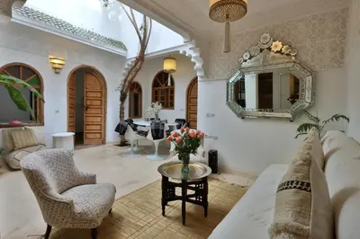 a living room with a couch and a table at Riad L'Hana, 3 ch, exclu medina in Marrakech