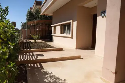 a patio of a house with a fence at Mi Casita Luxury Villa marrakech in Marrakech