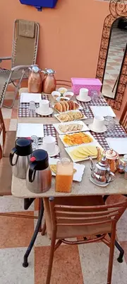 a table with a bunch of food on it at Dar Kouzzou in Marrakech