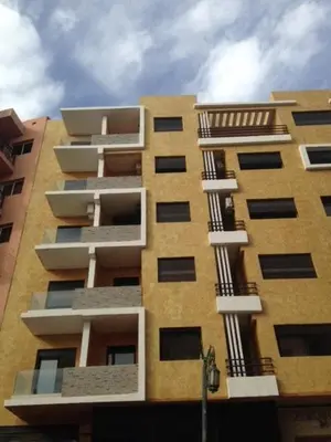 a tall building with balconies on the side of it at Studio Au Centre Ville Marrakech in Marrakech