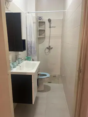 a bathroom with a sink and a toilet at Au cœur de la ville ocre in Marrakech