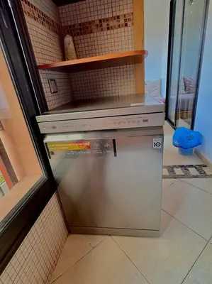 a small refrigerator in a kitchen with a window at MARRAKECH CENTRE Appartement in Marrakech