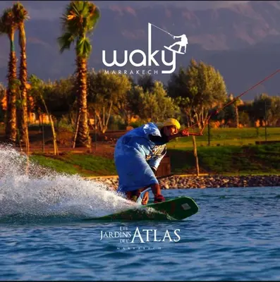 a man on a wake board in the water at Atlas Gardens Apartment in Sraghna