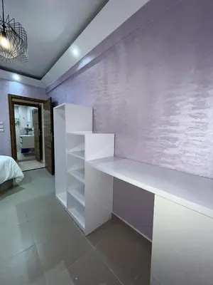 a white desk in a room with a wall at Marrakech l'aéroport in Marrakech