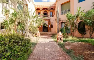 a brick path in front of a house at Prestige authentique in Marrakech
