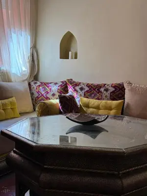 a coffee table in a living room with a couch at Authentic Family Apartment Riad stylein Gueliz in Marrakech