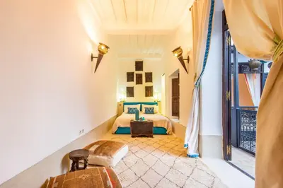 a room with a bed and a window at Dar Charkia in Marrakech