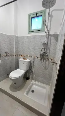a bathroom with a toilet and a shower and a sink at Bright with great view in Marrakech