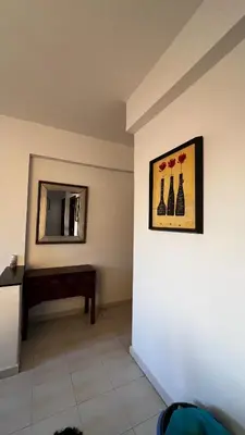 a room with a picture of vases on the wall at Bright with great view in Marrakech