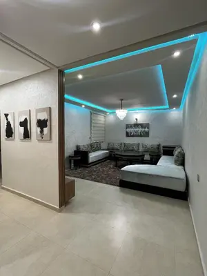 a bedroom with a bed and a blue light at Modern Apartment with Fully Equipped Kitchen Perfect Location in Marrakech in Marrakech